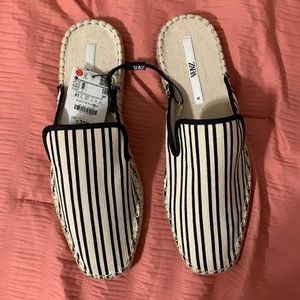 Black and white striped mules